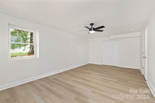 unfurnished room with ceiling fan and light hardwood / wood-style flooring