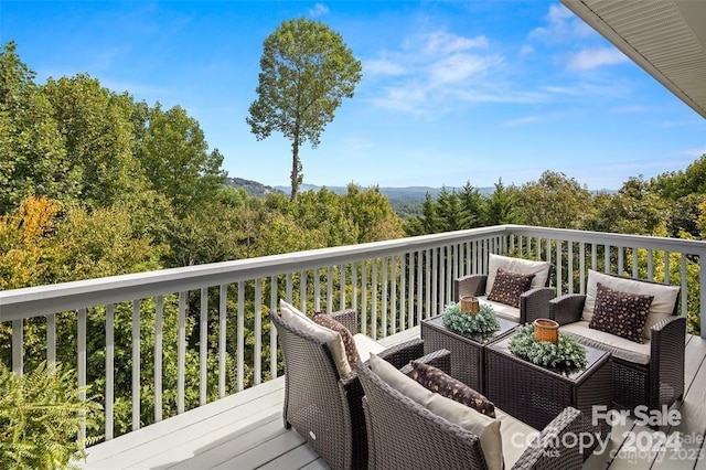 wooden deck with outdoor lounge area