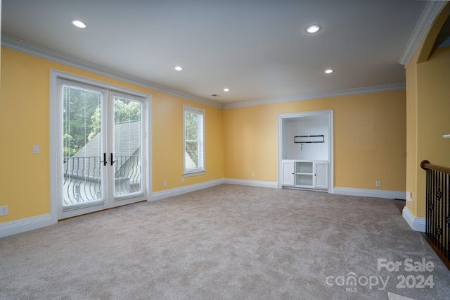 unfurnished living room with light carpet and crown molding