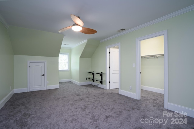 bonus room featuring light carpet and ceiling fan