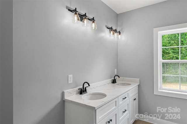 bathroom featuring vanity and plenty of natural light