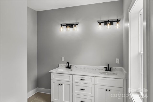 bathroom with wood-type flooring and vanity