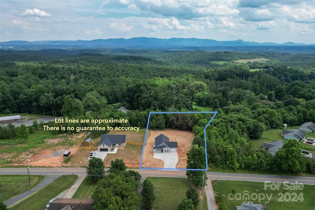 drone / aerial view featuring a mountain view