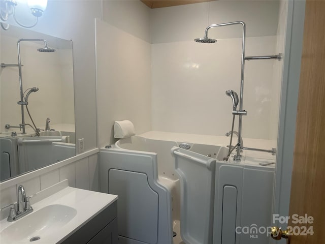 200 Olin Loop, Olin, NC 28660 - bathroom with backsplash, vanity, and a bathing tub