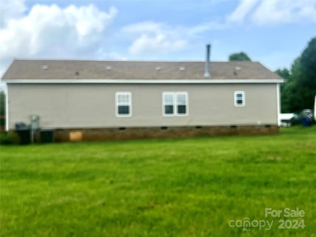 200 Olin Loop, Olin, NC 28660 - rear view of house featuring a lawn