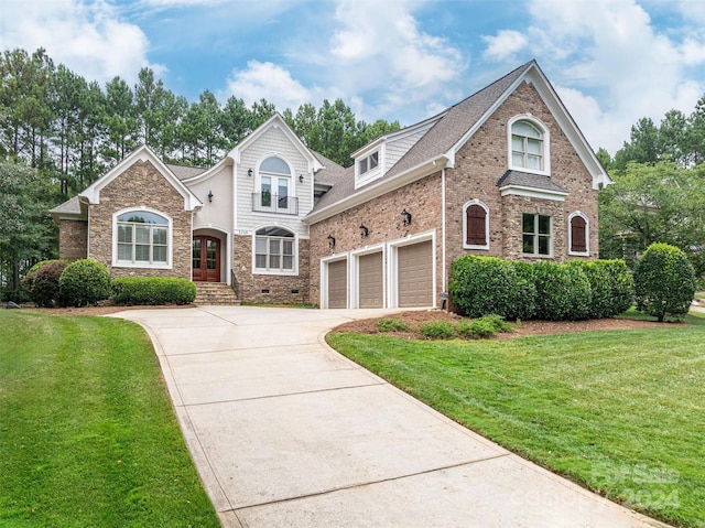 front facade featuring a garage and a front yard