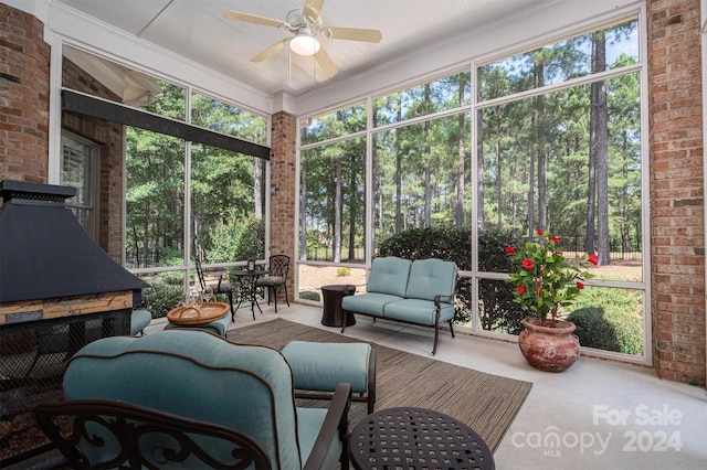 sunroom featuring a wealth of natural light and ceiling fan