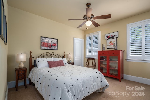 carpeted bedroom featuring ceiling fan