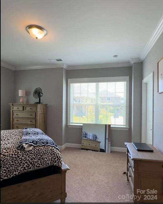 bedroom with light carpet, baseboards, and crown molding
