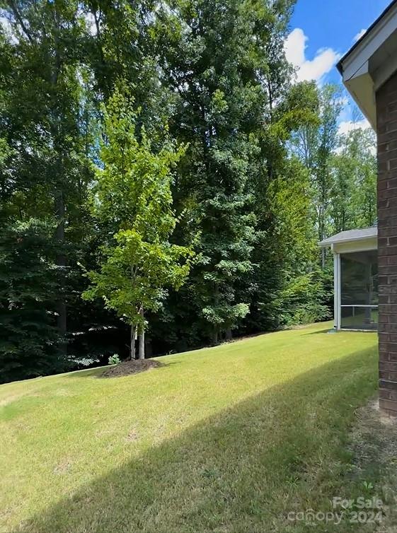 view of yard with a sunroom