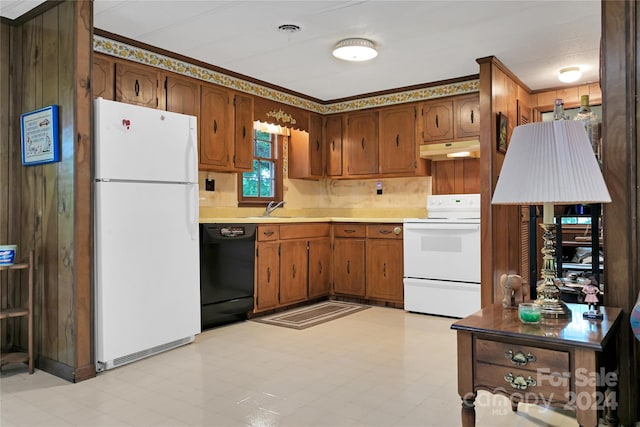 kitchen featuring white appliances and sink