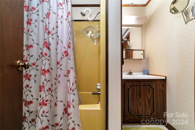 bathroom with shower / bath combo and vanity