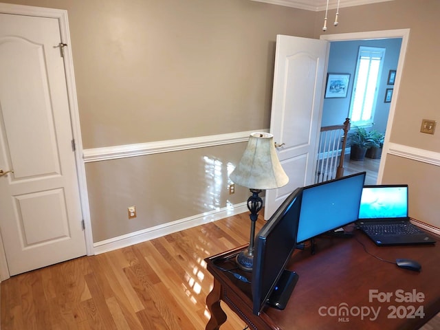 office space featuring ornamental molding and hardwood / wood-style floors