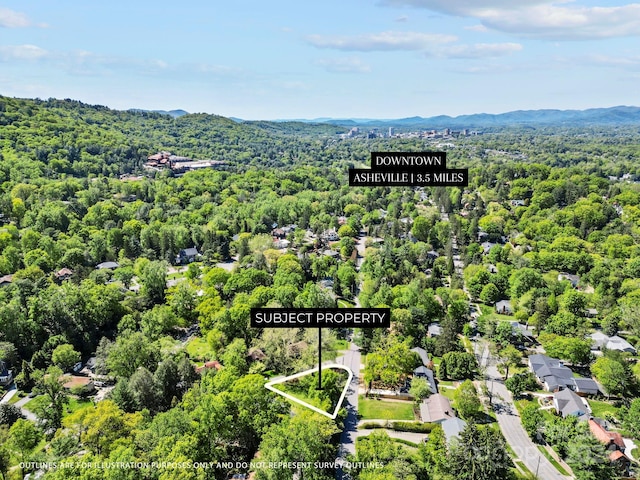 drone / aerial view featuring a mountain view