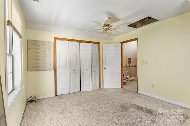 unfurnished bedroom featuring carpet flooring, a closet, and ceiling fan