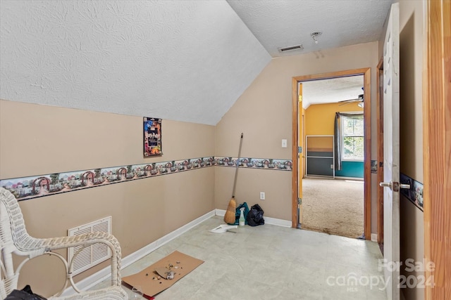 washroom with a textured ceiling