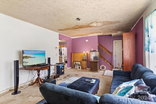 living room with a textured ceiling and carpet