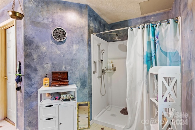 bathroom featuring tile patterned flooring, a textured ceiling, and a shower with curtain