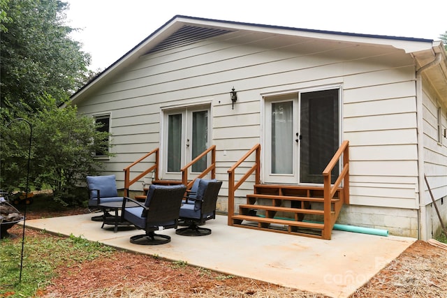 rear view of property featuring a patio