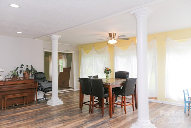 dining space featuring ornate columns, hardwood / wood-style floors, and ceiling fan