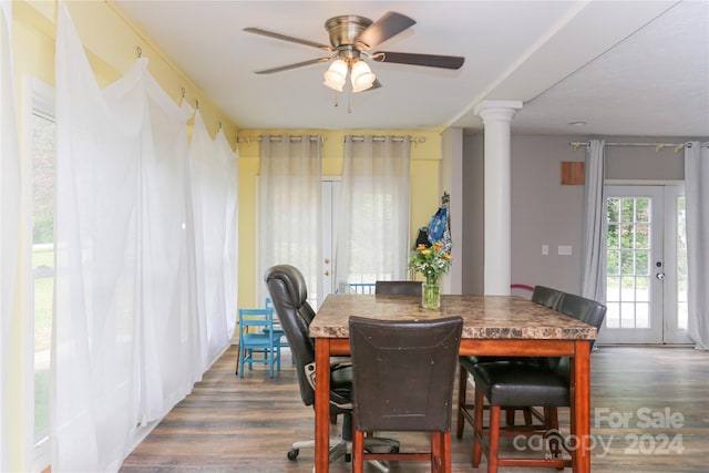 dining area with ornate columns, ceiling fan, hardwood / wood-style flooring, and french doors