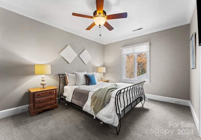 bedroom with ceiling fan, dark carpet, and ornamental molding