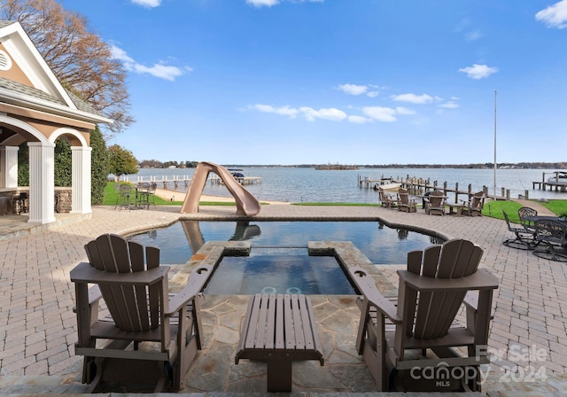 view of patio with a water view