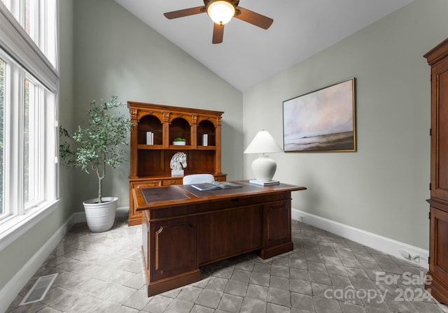 office space featuring light tile patterned floors, high vaulted ceiling, and ceiling fan