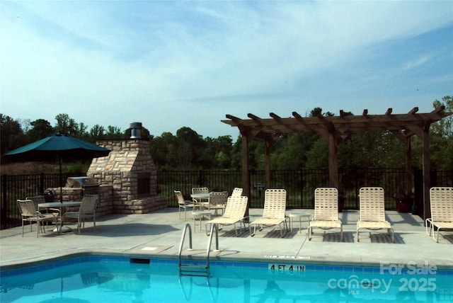 community pool with a patio, a pergola, an outdoor brick fireplace, and fence