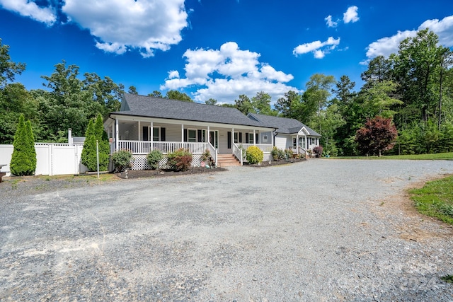 ranch-style house featuring covered porch