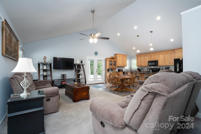 carpeted living room featuring high vaulted ceiling, ceiling fan, and french doors