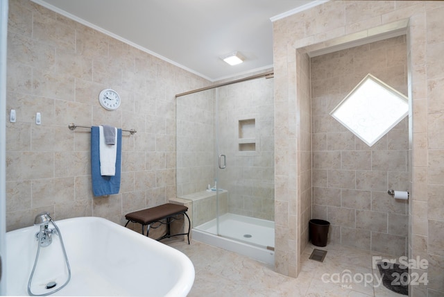 bathroom featuring plus walk in shower, ornamental molding, tile floors, and tile walls