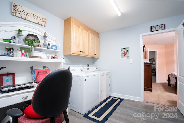 laundry area featuring cabinets, carpet floors, and washing machine and clothes dryer