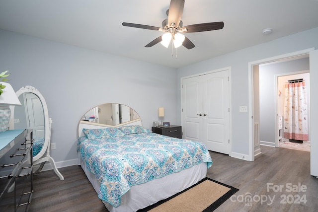 bedroom with dark hardwood / wood-style floors, a closet, and ceiling fan