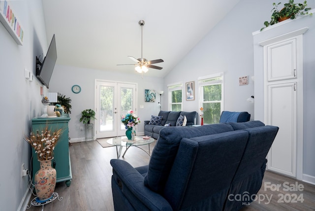 living room with high vaulted ceiling, ceiling fan, french doors, and dark wood-type flooring