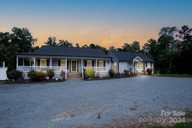 ranch-style home with covered porch