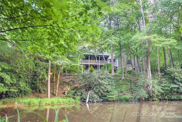 back of house featuring a water view