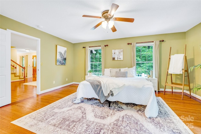 bedroom featuring wood-type flooring and ceiling fan