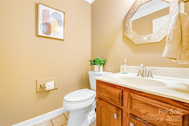 bathroom featuring vanity, toilet, crown molding, and tile patterned flooring