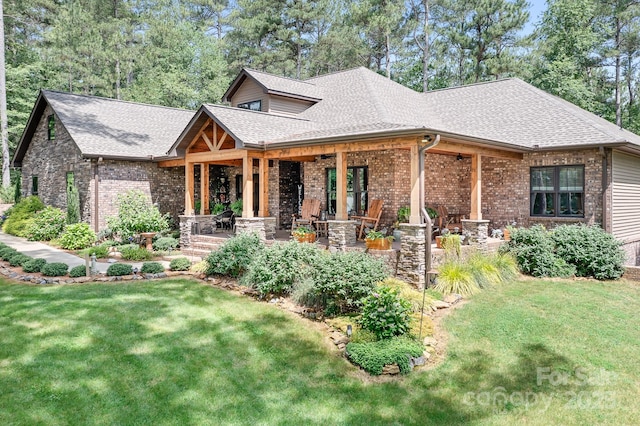 view of front facade featuring a front yard and a porch