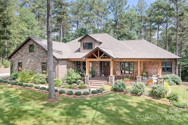 view of front facade with a front lawn and covered porch