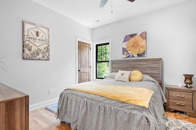 bedroom featuring light hardwood / wood-style flooring and ceiling fan