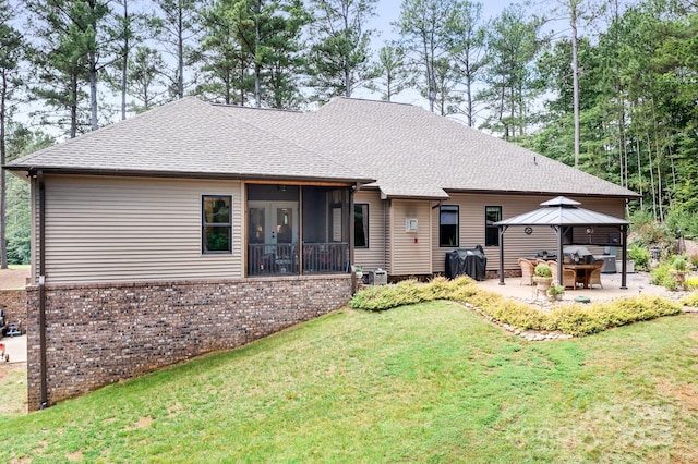 back of house featuring a lawn, a sunroom, central AC unit, a gazebo, and a patio