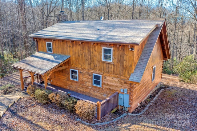 view of side of home featuring a porch