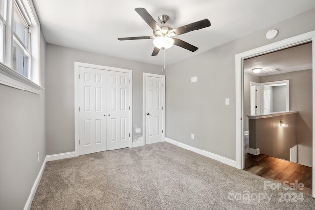 unfurnished bedroom featuring carpet and ceiling fan