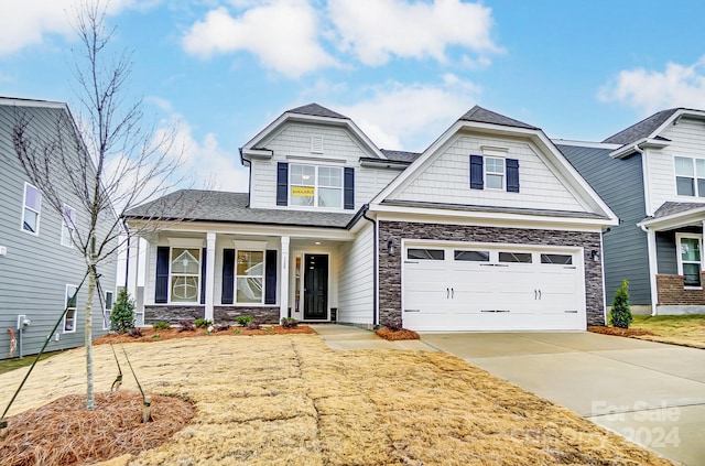 craftsman house with a garage