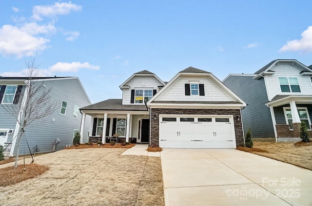 craftsman inspired home featuring a porch and a garage