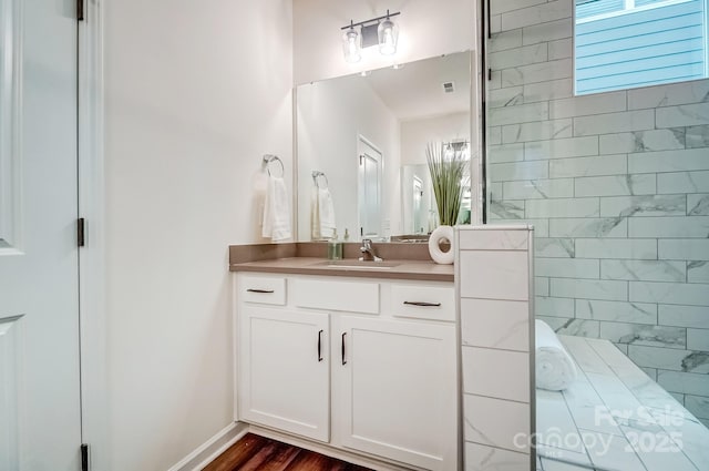 bathroom featuring vanity and wood-type flooring