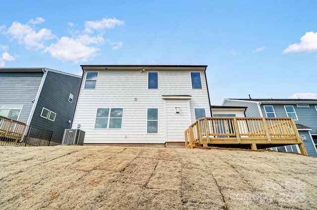 rear view of house with a wooden deck