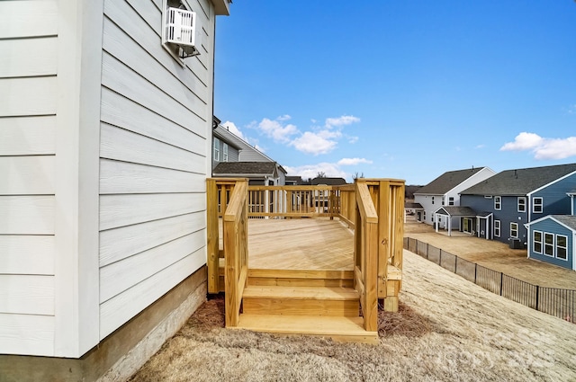 wooden terrace featuring cooling unit